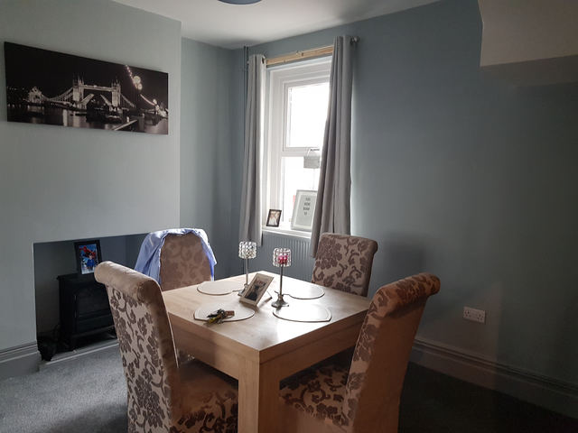 Dining room with table and chairs and a window to the rear