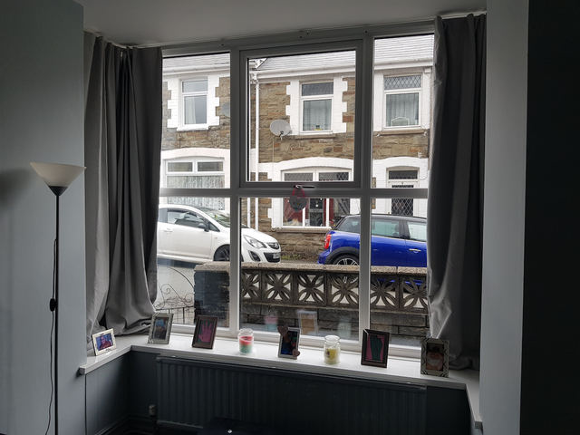 Living room with large bay window looking onto Gaen Street